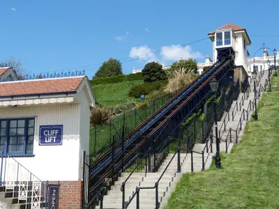 a train on a bridge over some stairs at Southend Central Hotel - Close to Beach, City Centre, Train Station & Southend Airport in Southend-on-Sea
