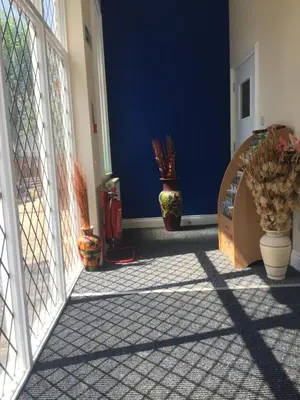 a room with a door and some plants on the floor at Southend Central Hotel - Close to Beach, City Centre, Train Station & Southend Airport in Southend-on-Sea