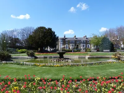 a park with a fountain in front of a house at Southend Central Hotel - Close to Beach, City Centre, Train Station & Southend Airport in Southend-on-Sea