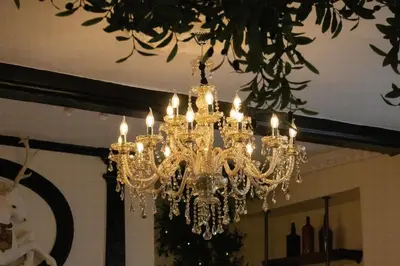 a chandelier hanging from a ceiling in a room at The Scole Hotel in Scole