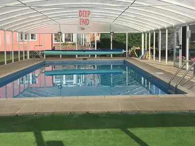 an empty swimming pool with an open canopy at Henry's Barn - Ukc3168 in Walpole