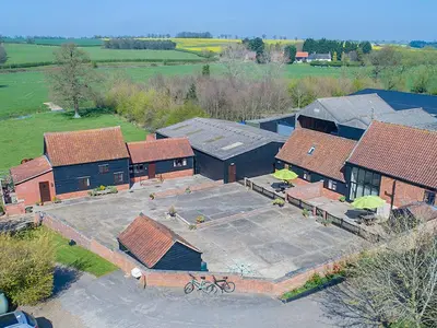 an overhead view of a building with a parking lot at Old Corn Mill - Ukc3170 in Walpole
