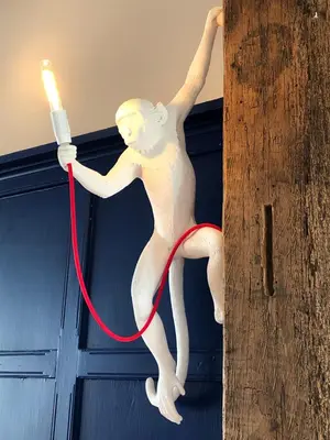 a statue of a man holding a hula hoop at The Bull Inn in Mildenhall