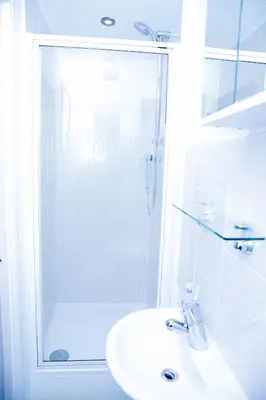 a white bathroom with a shower and a sink at Stay 69G - Hush View House, Romford, London Havering in Romford
