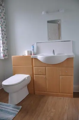 a bathroom with a toilet and a sink at Victoria Villa Guesthouse in Clacton-on-Sea