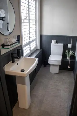 a bathroom with a sink and a toilet at J.D.Young in Harleston