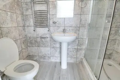 a bathroom with a toilet and a sink at Stanwell Stansted Airport in Takeley