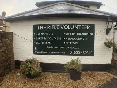 a sign on the side of a building at The Rifle Volunteer in Ware