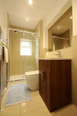 a bathroom with a shower and a toilet and a sink at The Rathmore in Cambridge