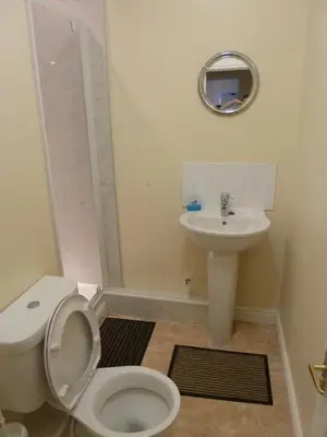 a bathroom with a toilet and a sink at The Rathmore in Cambridge