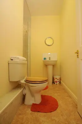 a bathroom with a toilet and a sink at The Rathmore in Cambridge