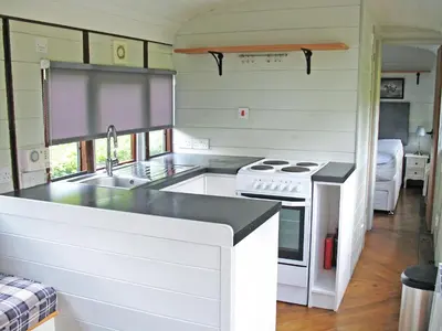 a kitchen with a sink and a stove at Italian Carriage-Ukc3492 in Wetheringsett
