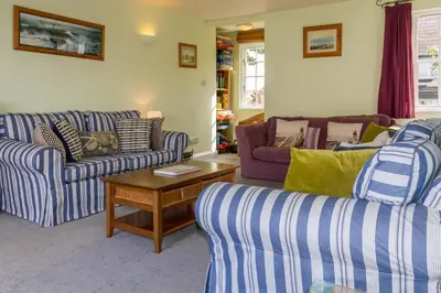 a living room with two couches and a coffee table at 4 Bell Lodge, Thorpeness in Thorpeness