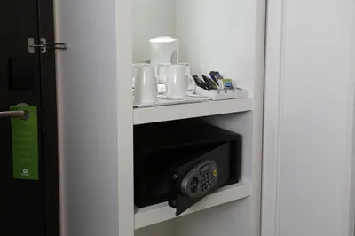 a room with a wall mounted microwave in a room at Holiday Inn Southend by IHG in Southend-on-Sea