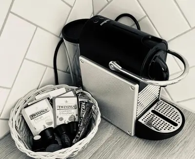 a basket filled withiazepamiazepines and a bag on a wall at Kingfisher Nook at Waveney Farm in Hoxne