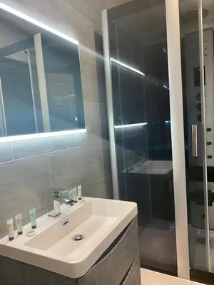 a bathroom with a white sink and a shower at The Royal Hotel - Clacton On Sea in Clacton-on-Sea