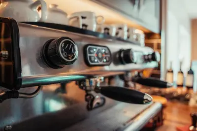 a close up of a coffee machine on a counter at The Bull Inn in Woolpit