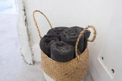 a basket filled with black yarn on a wall at The Blackwater Suite in West Mersea