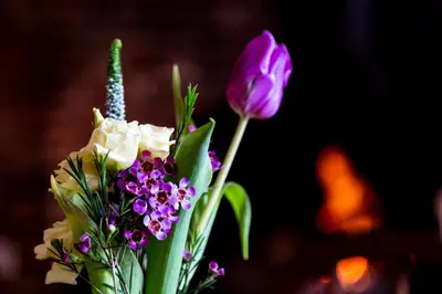 a vase filled with purple and white flowers at The Cross Keys, Aldeburgh in Aldeburgh