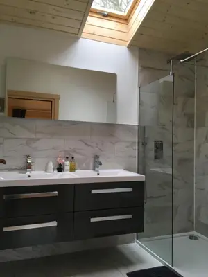 a bathroom with a sink and a shower at The Orchard Bramble Lodge in Hadleigh
