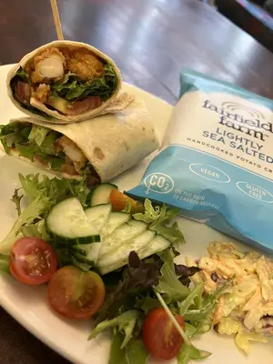 a plate of food with a sandwich and a salad at The Blue Boar - Maldon in Maldon