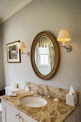 a bathroom with a sink and a mirror at The Jockey Club Rooms in Newmarket