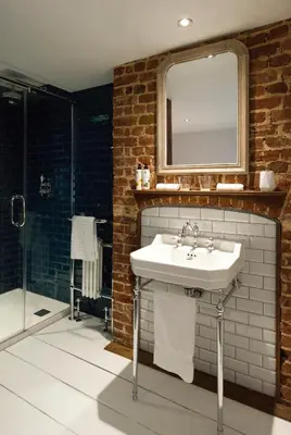 a bathroom with a sink and a mirror at The Coach House in Potton