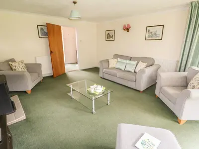 a living room with couches and a coffee table at The Bothy in Eye