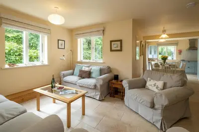 a living room with two couches and a table at Willow House in Knodishall, Sleeps 7 - Only a short drive from Aldeburgh, Thorpeness & Snape Maltings - Managed by Aldeburgh Coastal Cottages in Aldringham
