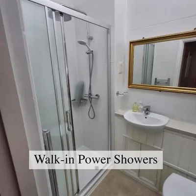 a bathroom with a shower and a sink at The Abbey Hotel & Apartments in Bury Saint Edmunds