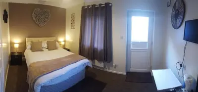 a hotel room with a bed and a window at Red Lion in Swaffham