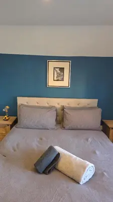 a bed with a towel on top of it at The Horse and Groom Guest House in Swaffham
