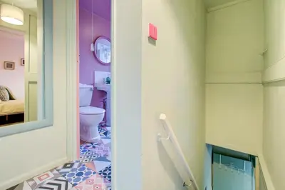 a bathroom with a toilet and a sink at Cosy Cottage Fireplace Patio Pet Train Stn in Wivenhoe