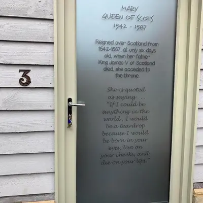 a door with a sign on it on a house at The British Queen, Meldreth in Meldreth