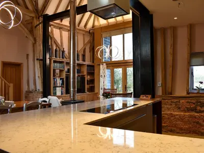 a kitchen with a large island in a room at Ivy Todd Barn in Ashdon