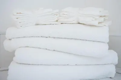 a stack of white towels stacked on top of each other at Colchester Town Duplex Apartment in Colchester