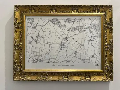a picture of a map in a gold frame at The Stables & Silos in Braintree