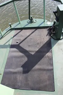 a shadow of a pole on the deck of a boat at Waterbeach Boatel in Cambridge