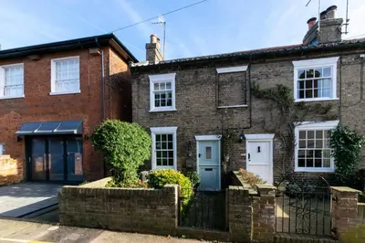 an old brick house with a blue door at 1 Bed in Woodbridge oc-jsm in Woodbridge