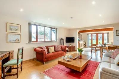 a living room with a couch and a table at 1 Bed in Woodbridge oc-meb in Sudbourne
