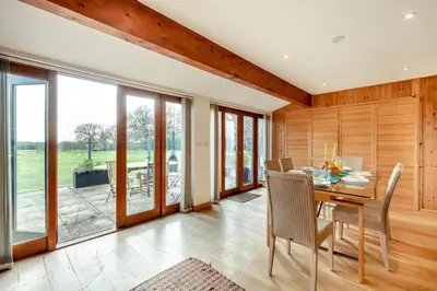 a dining room with a table and chairs at 1 Bed in Woodbridge oc-meb in Sudbourne