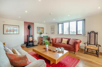a living room with a couch and a table at 1 Bed in Woodbridge oc-meb in Sudbourne