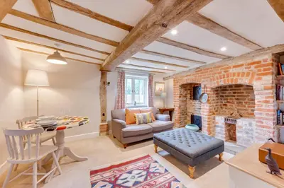 a living room with a brick wall at 1 Bed in Ipswich oc-spha in Harkstead