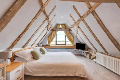 a bedroom with a bed and a window at 1 Bed in Ipswich oc-spha in Harkstead
