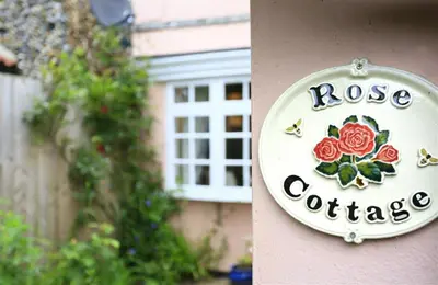 a rose cottage sign on the side of a building at 1 Bed in Great Bealings oc-rosec in Bealings