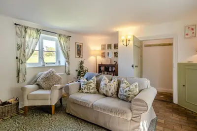 a living room with a couch and two chairs at 1 Bed in Great Bealings oc-sfgar in Bealings