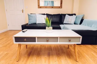a living room with a couch and a coffee table at Comfortable Colchester Home in Colchester