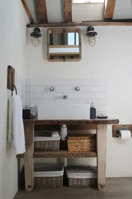 a bathroom with a sink and a mirror at The Dovecote - unique self-contained 1bed renovated barn in Saffron Walden