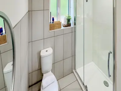 a white bathroom with a toilet and a shower at Hare Lodge - Uk30604 in Pidley