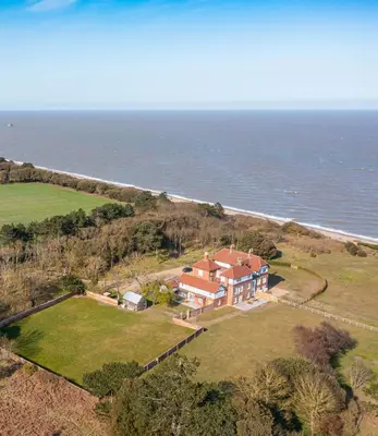 an aerial view of a house on the ocean at The Dower Lodge in Sizewell